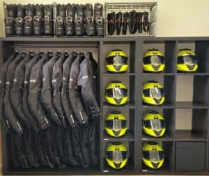 Safe motorcycle gear setup with helmets, jackets, and gloves for rider training.